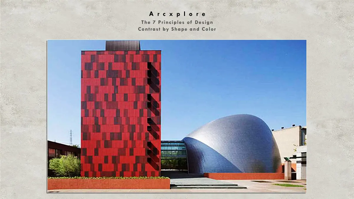 "Contrast by shape and color in architecture – A tall, rectangular red building with a pixelated pattern stands in stark contrast to a smooth, curved metallic structure beside it." what's the principle of design What's the principle of design?"